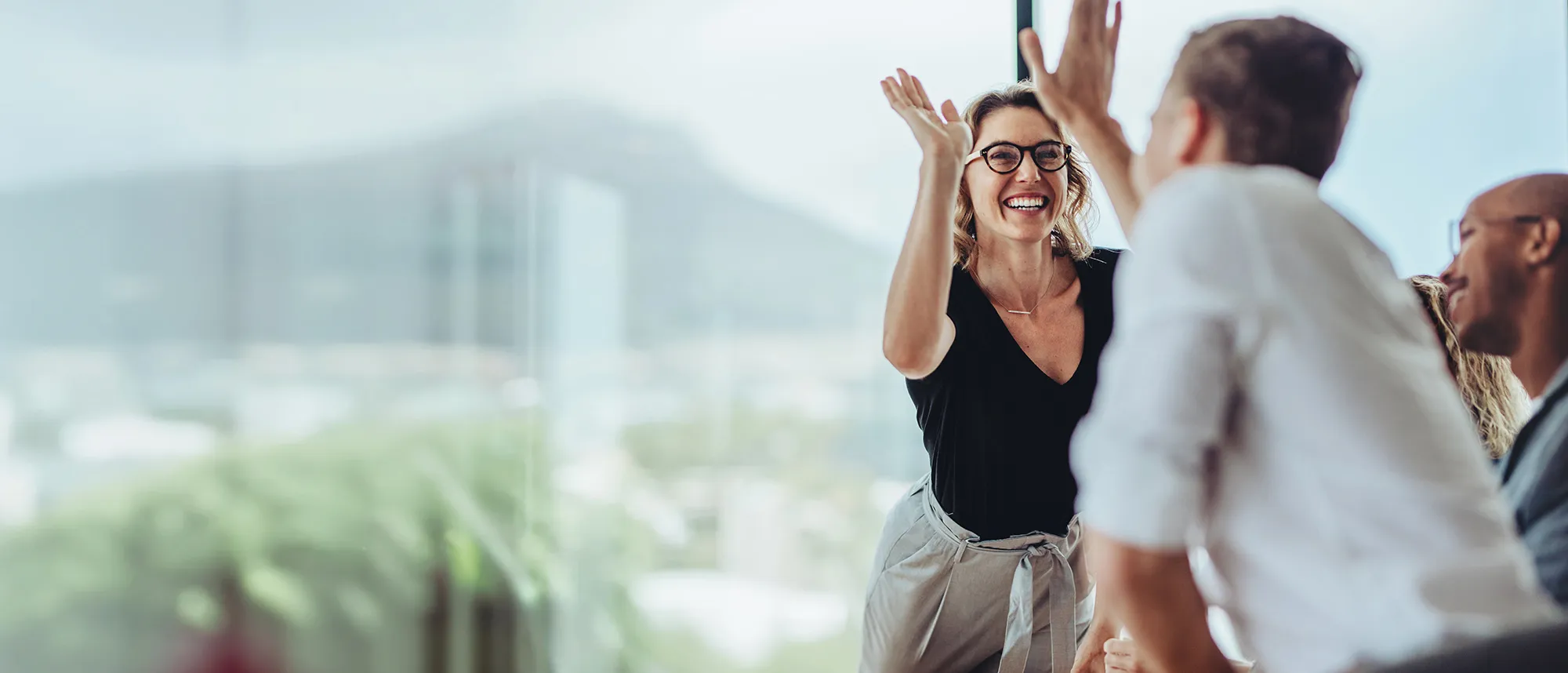 Businesswoman giving a high five
